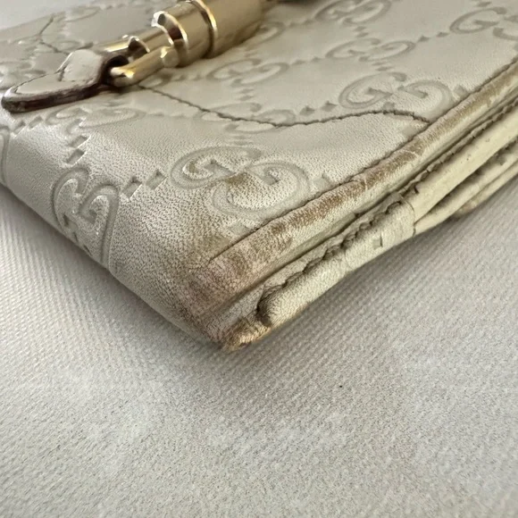 Gucci Guccissima Ivory Leather GG Logo BiFold Wallet, Gold Piston Closure